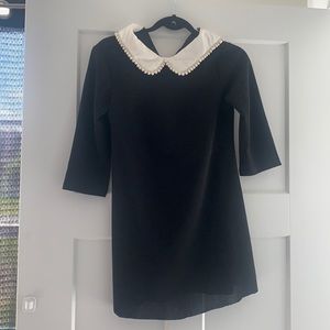Black Shein dress with white pearl collar detail.